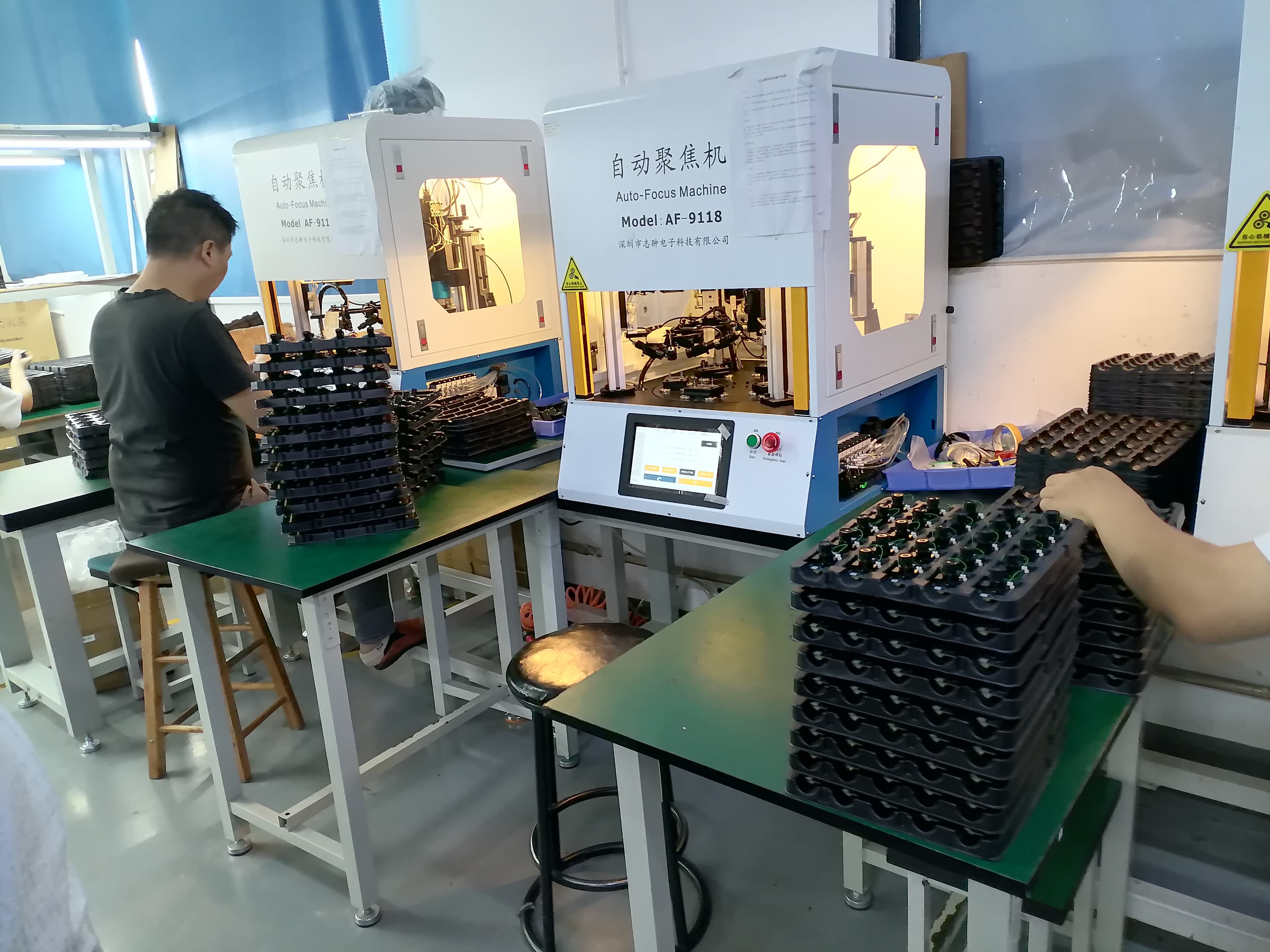 JBC camera production line with auto focus machines